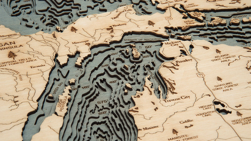 Close-up of the layered birch depths on a Great Lakes 3D wood map