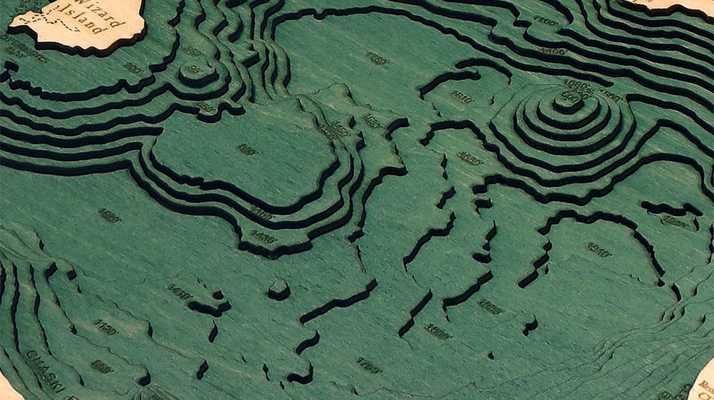 Close-up of the stacked birch layers of a Crater Lake 3D wood map