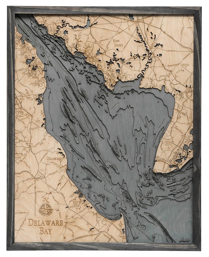 Delaware Bay 3D layered wood map in laser-cut Baltic birch, shown framed against a light wall
