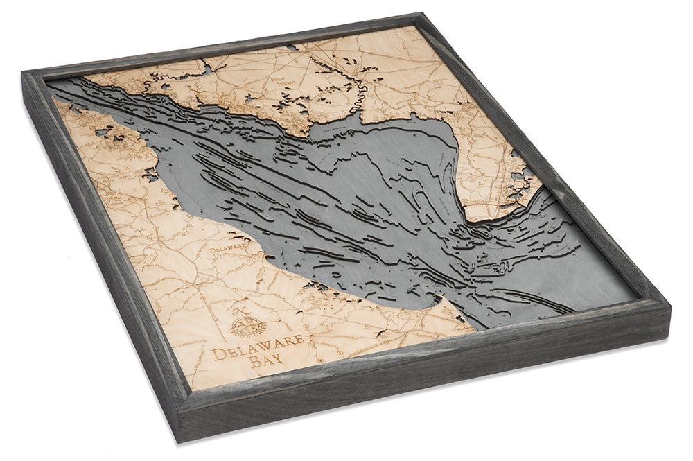 Delaware Bay 3D layered wood map in laser-cut Baltic birch, shown framed against a light wall