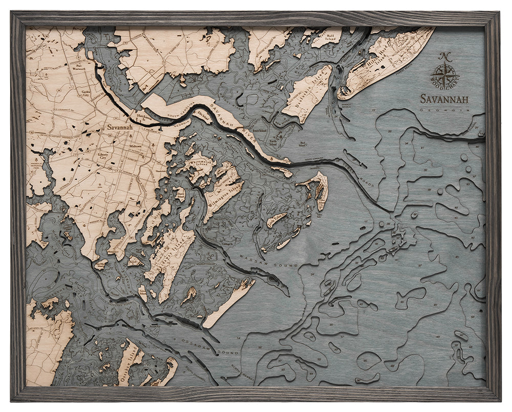 Savannah, Georgia 3D layered wood map in laser-cut Baltic birch, shown framed against a light wall