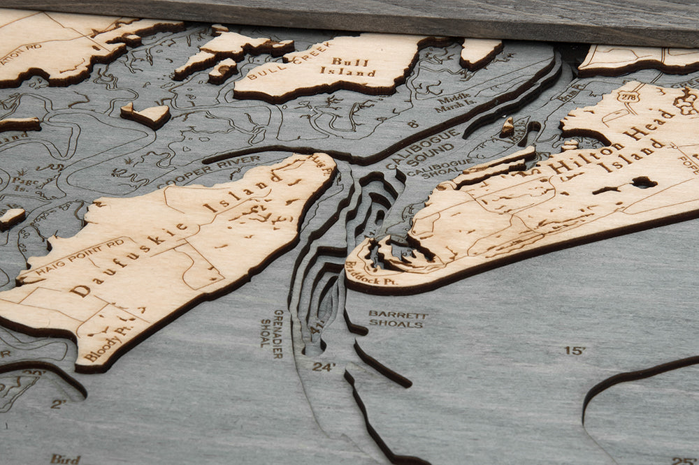 Savannah, Georgia 3D layered wood map in laser-cut Baltic birch, shown framed against a light wall