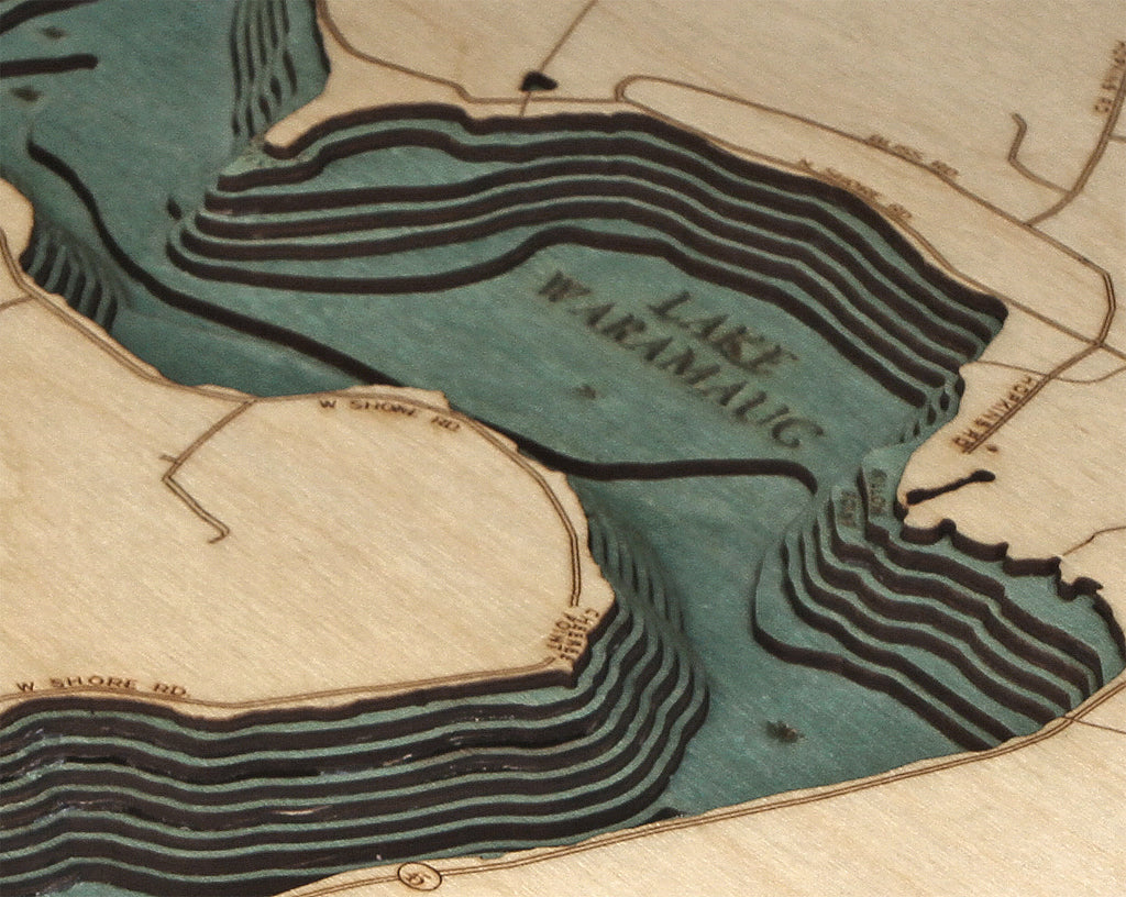 Lake Waramaug, Connecticut 3D layered wood map in laser-cut Baltic birch, shown framed against a light wall