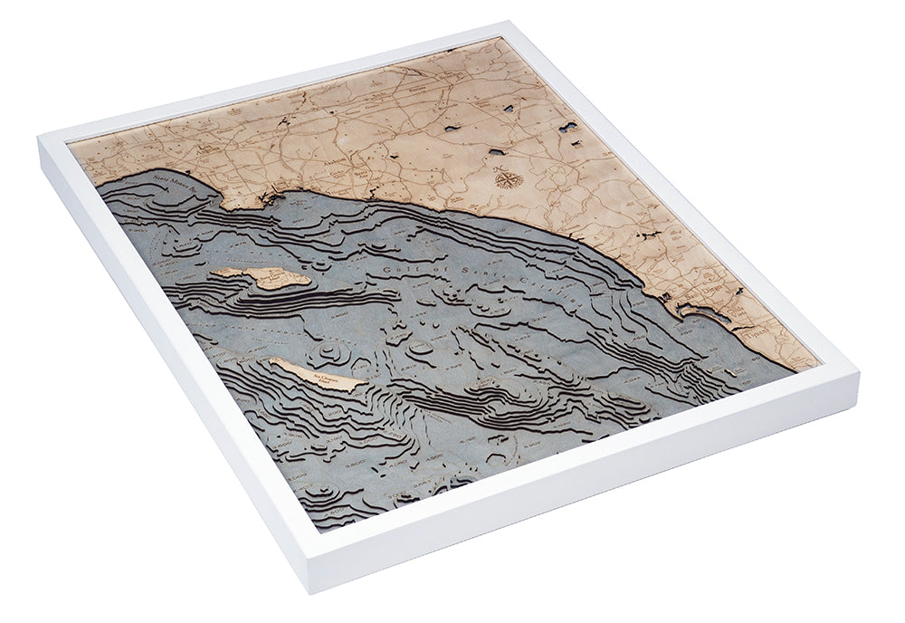 LA to San Diego, California 3D layered wood map in laser-cut Baltic birch, shown framed against a light wall