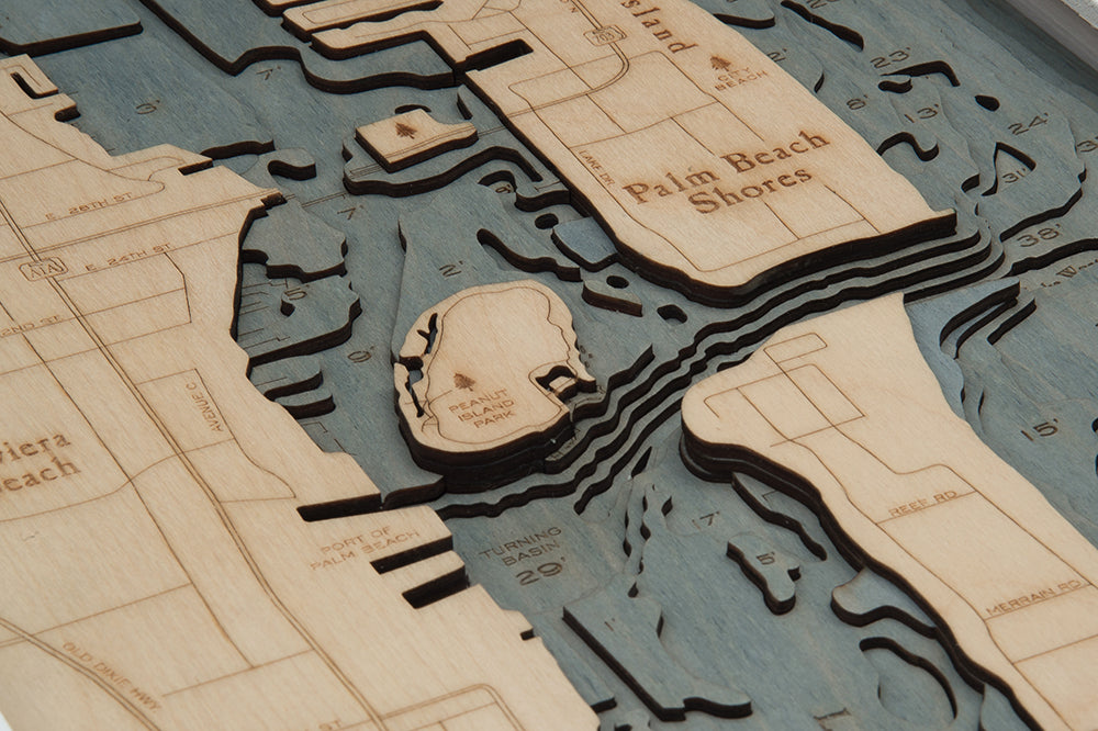 Palm Beach, Florida 3D layered wood map in laser-cut Baltic birch, shown framed against a light wall