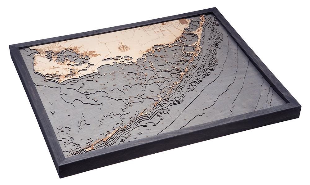 Upper Florida Keys 3D layered wood map in laser-cut Baltic birch, shown framed against a light wall