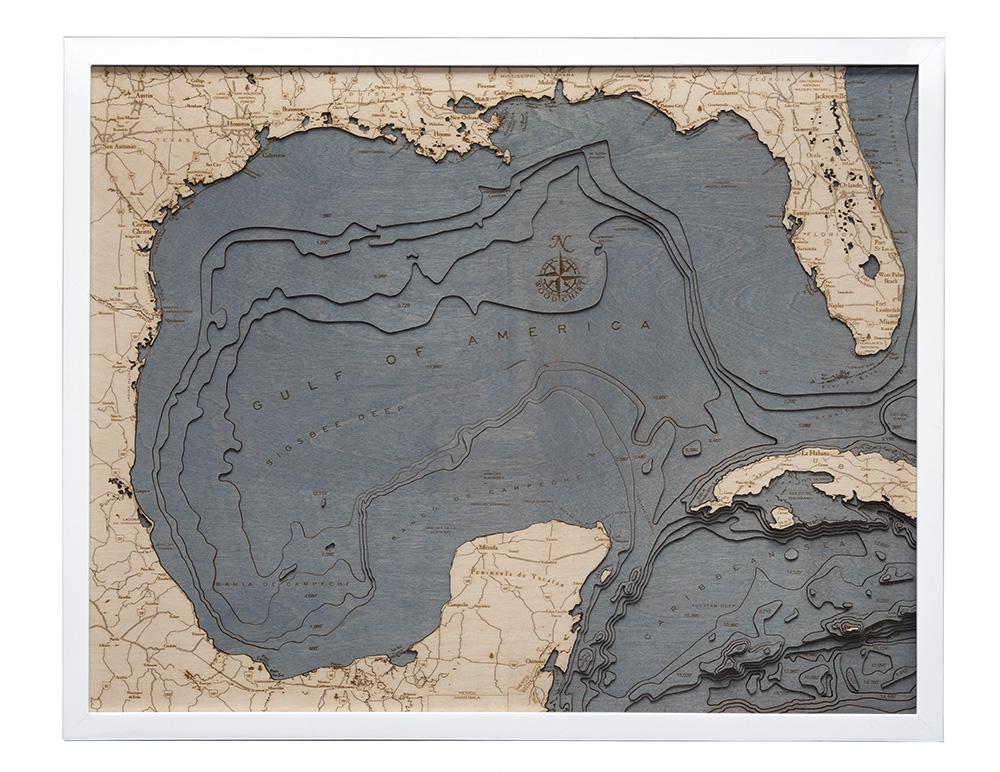 Gulf Of America 3D layered wood map in laser-cut Baltic birch, shown framed against a light wall