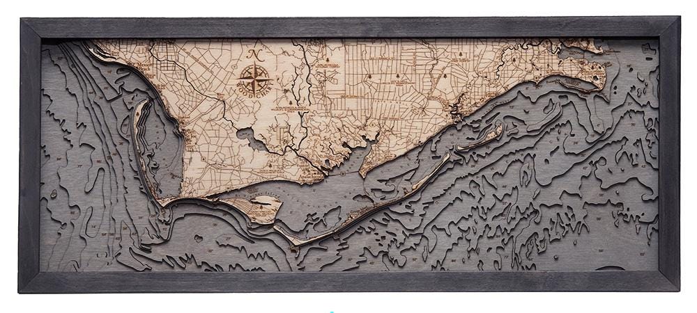 Mexico Beach to Bald Point, Florida 3D layered wood map in laser-cut Baltic birch, shown framed against a light wall