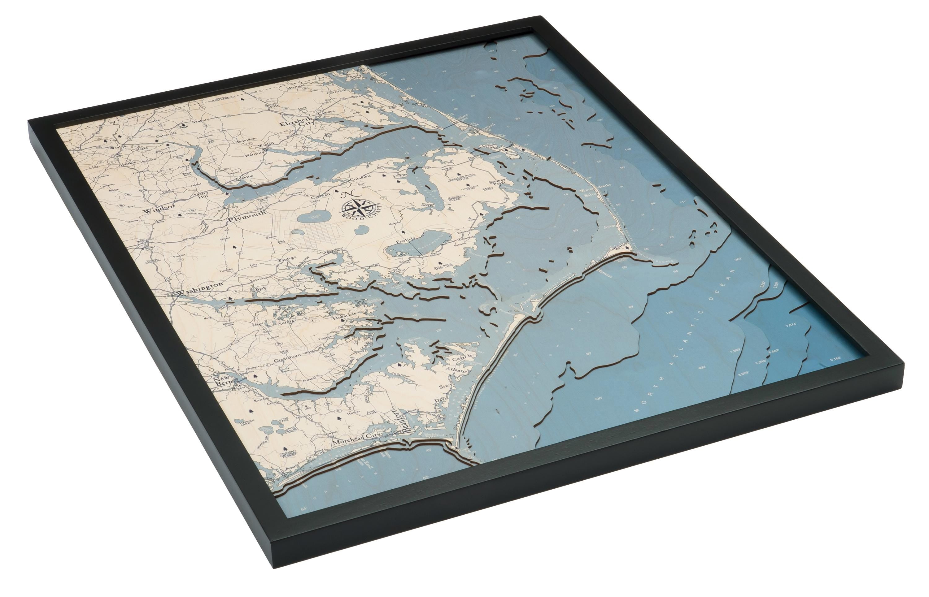 Outer Banks, North Carolina 3D layered wood map in laser-cut Baltic birch, shown framed against a light wall