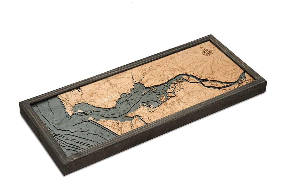 Columbia River Mouth, Oregon 3D layered wood map in laser-cut Baltic birch, shown framed against a light wall