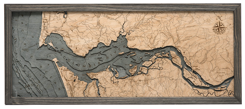 Columbia River Mouth, Oregon 3D layered wood map in laser-cut Baltic birch, shown framed against a light wall