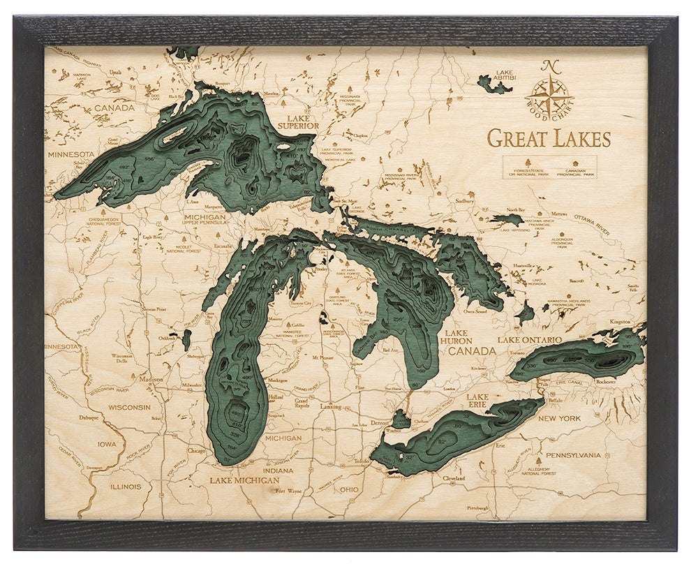 Great Lakes 3D layered wood map in laser-cut Baltic birch, shown framed against a light wall