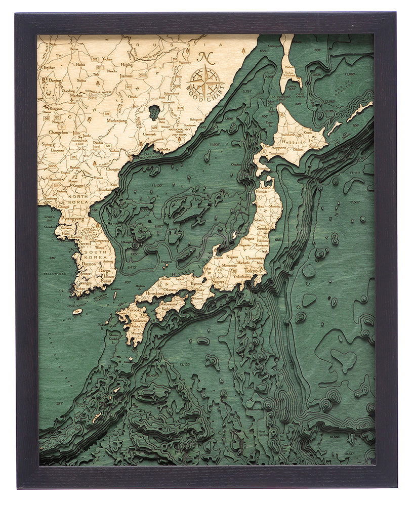 Japan 3D layered wood map in laser-cut Baltic birch, shown framed against a light wall