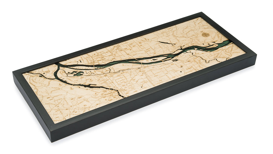 Portland, Oregon 3D layered wood map in laser-cut Baltic birch, shown framed against a light wall