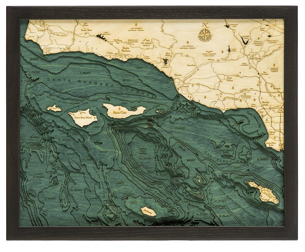 Santa Barbara, California 3D layered wood map in laser-cut Baltic birch, shown framed against a light wall