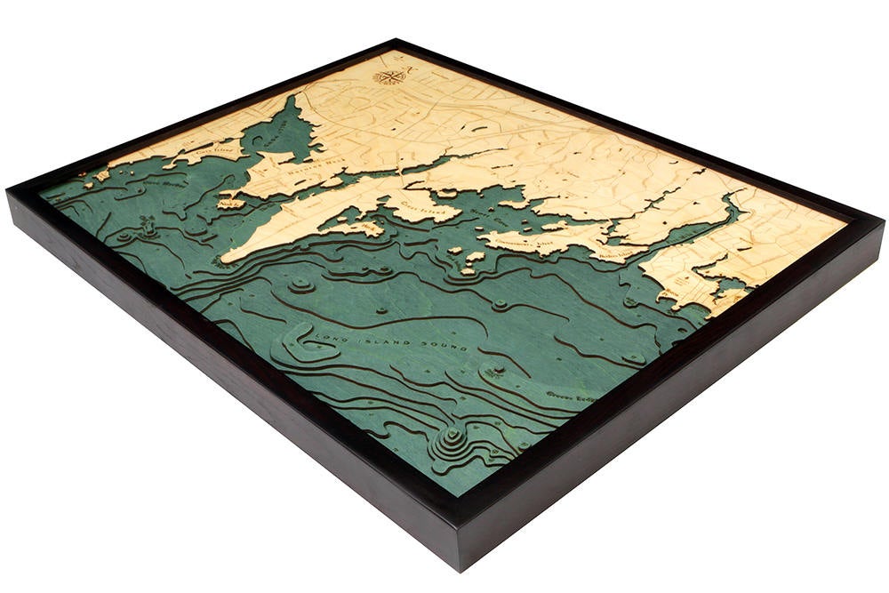 Darien, Connecticut 3D layered wood map in laser-cut Baltic birch, shown framed against a light wall