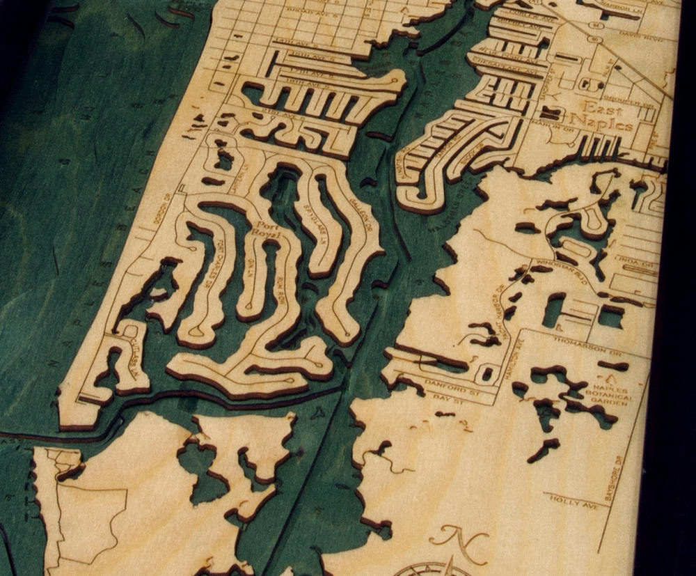 Naples, Florida 3D layered wood map in laser-cut Baltic birch, shown framed against a light wall