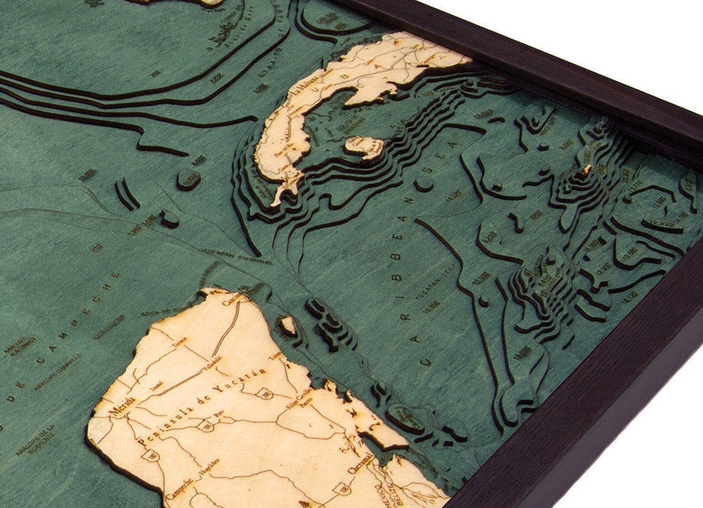 Gulf Of Mexico 3D layered wood map in laser-cut Baltic birch, shown framed against a light wall