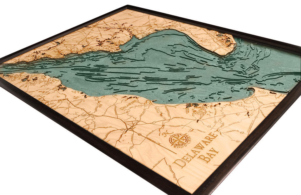 Delaware Bay 3D layered wood map in laser-cut Baltic birch, shown framed against a light wall