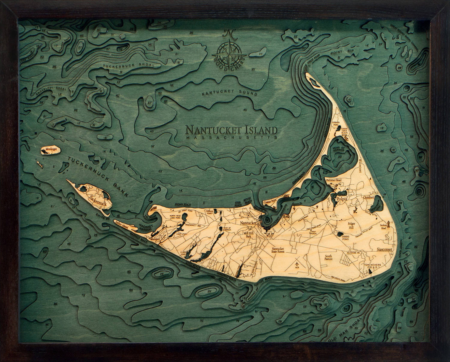 Nantucket, Massachusetts 3D layered wood map in laser-cut Baltic birch, shown framed against a light wall