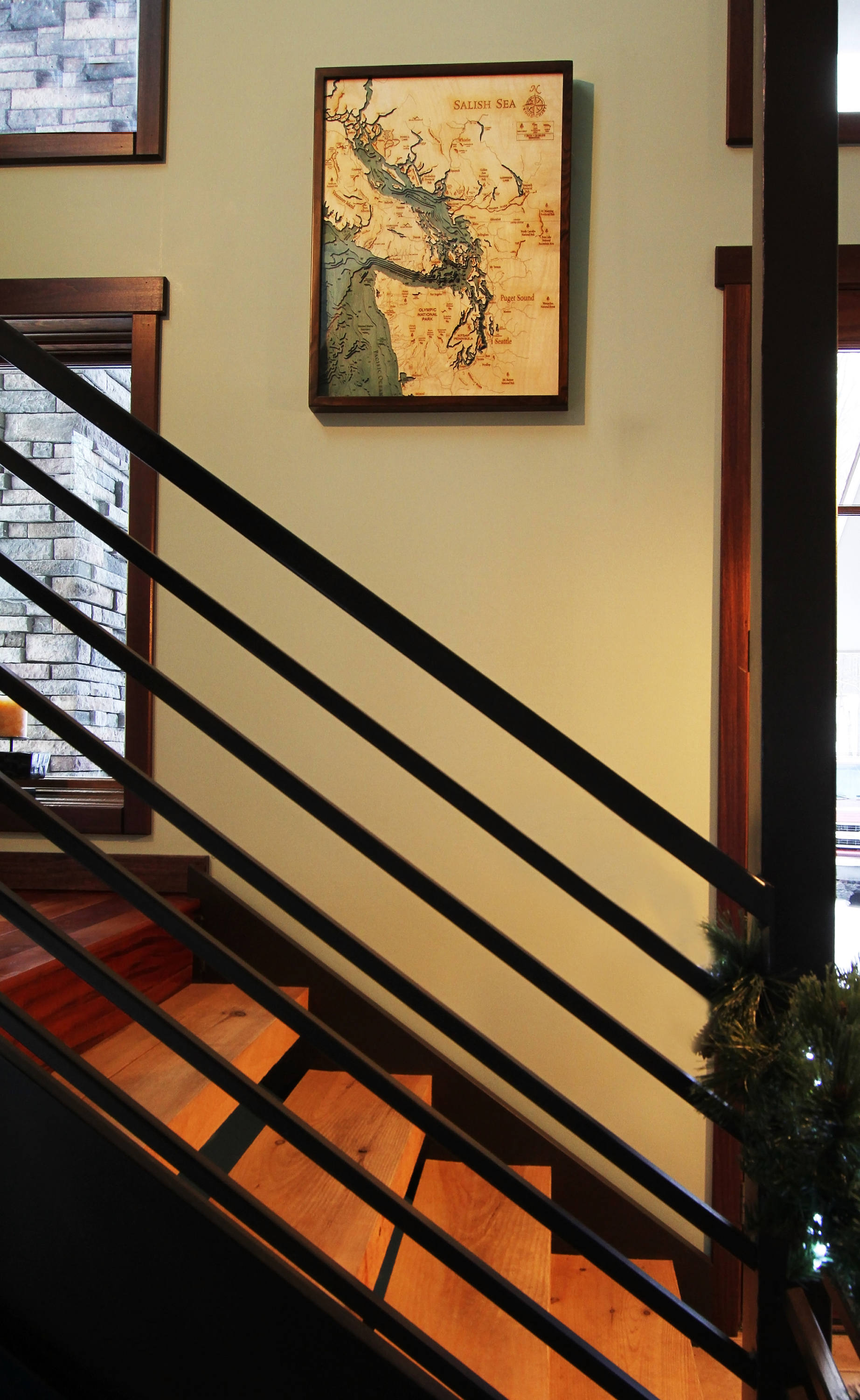 Lake George, New York 3D layered wood map in laser-cut Baltic birch, shown framed against a light wall