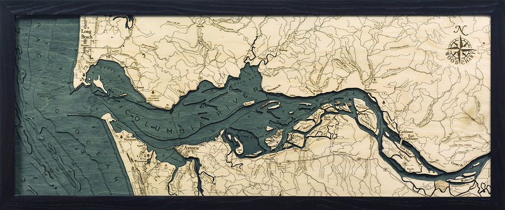 Columbia River Mouth, Oregon 3D layered wood map in laser-cut Baltic birch, shown framed against a light wall