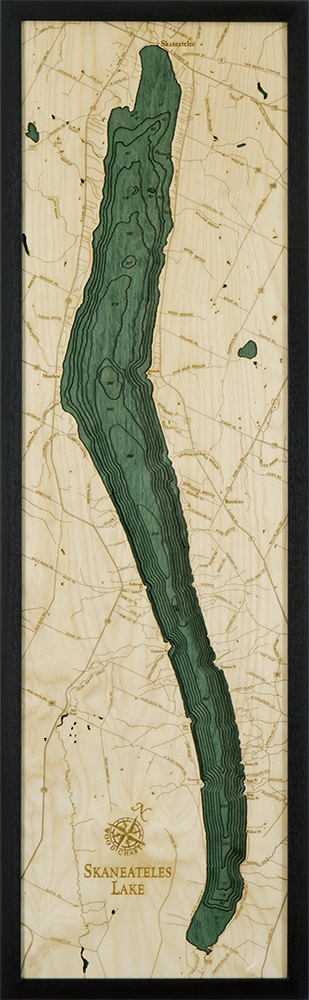 Lake Skaneateles, New York 3D layered wood map in laser-cut Baltic birch, shown framed against a light wall