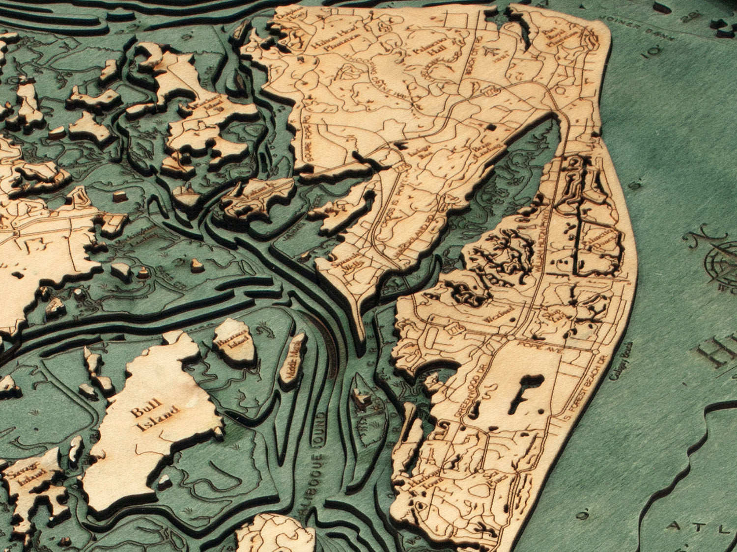Hilton Head, South Carolina 3D layered wood map in laser-cut Baltic birch, shown framed against a light wall