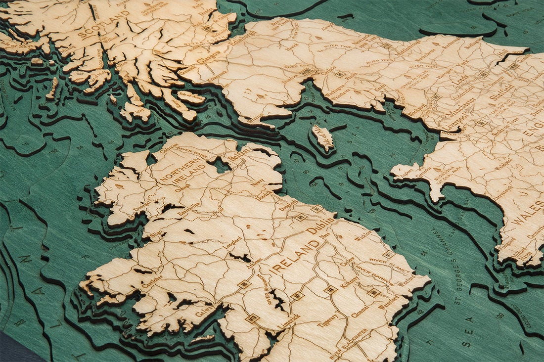 United Kingdom 3D layered wood map in laser-cut Baltic birch, shown framed against a light wall
