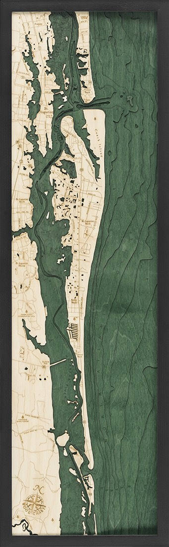 Saint Augustine, Florida 3D layered wood map in laser-cut Baltic birch, shown framed against a light wall