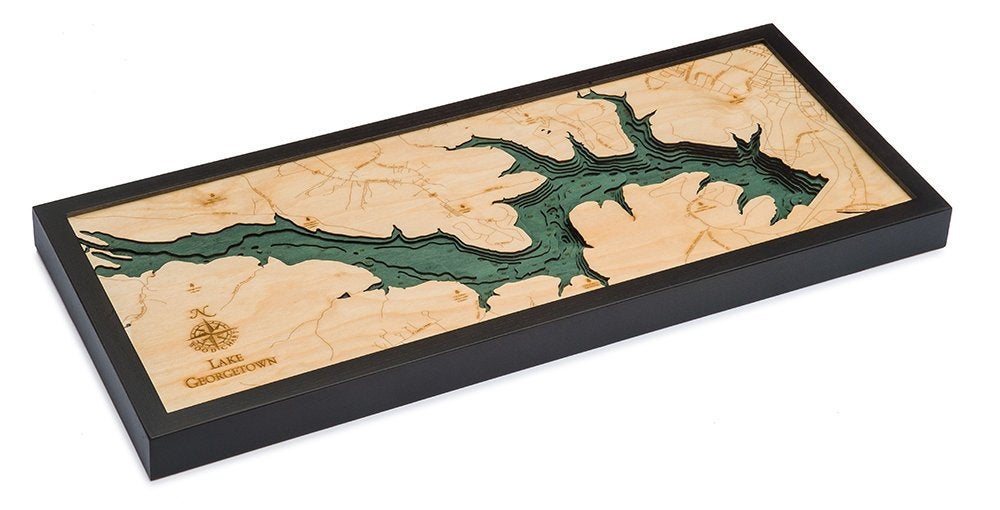 Lake Georgetown, Texas 3D layered wood map in laser-cut Baltic birch, shown framed against a light wall
