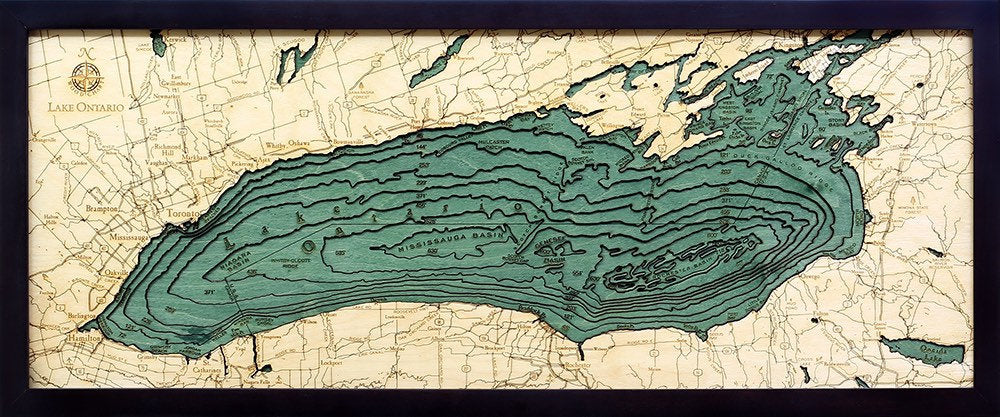 Lake Ontario 3D layered wood map in laser-cut Baltic birch, shown framed against a light wall