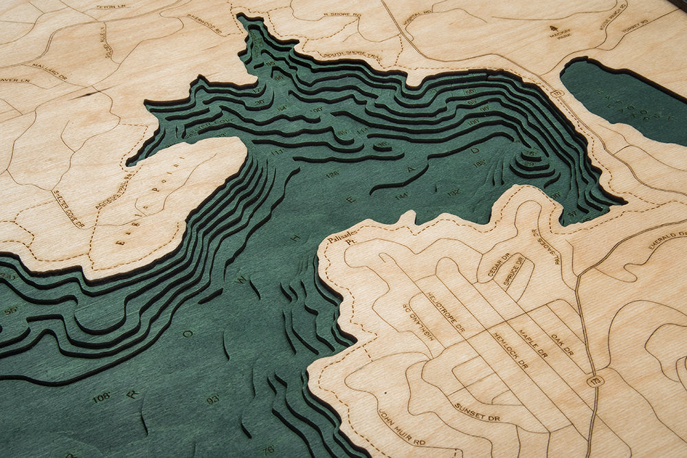 Lake Arrowhead, California 3D layered wood map in laser-cut Baltic birch, shown framed against a light wall