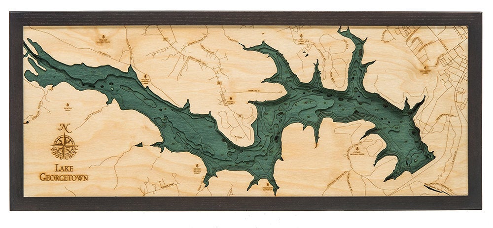 Lake Georgetown, Texas 3D layered wood map in laser-cut Baltic birch, shown framed against a light wall