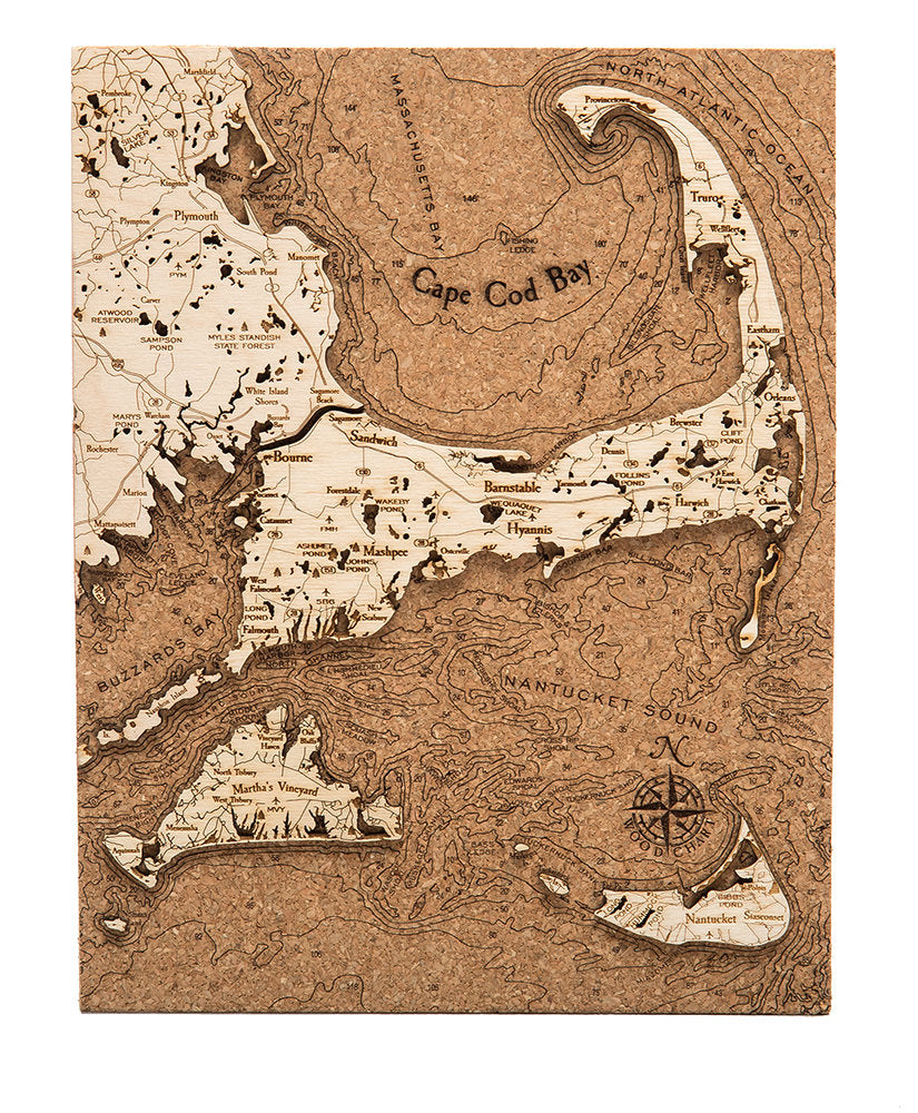 Cape Cod, Massachusetts framed cork map in laser-cut Baltic birch, shown framed against a light wall