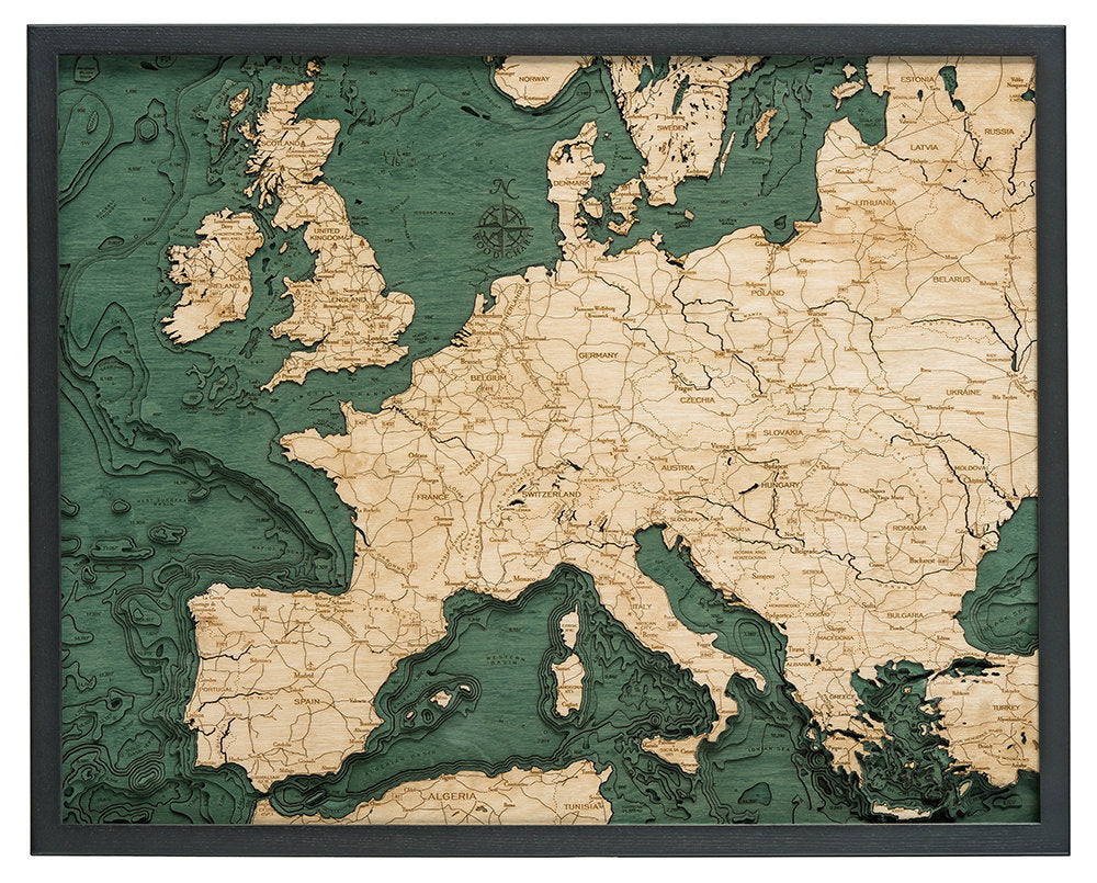 Western Europe 3D layered wood map in laser-cut Baltic birch, shown framed against a light wall