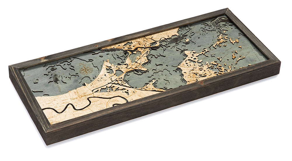 New Orleans, Louisiana 3D layered wood map in laser-cut Baltic birch, shown framed against a light wall