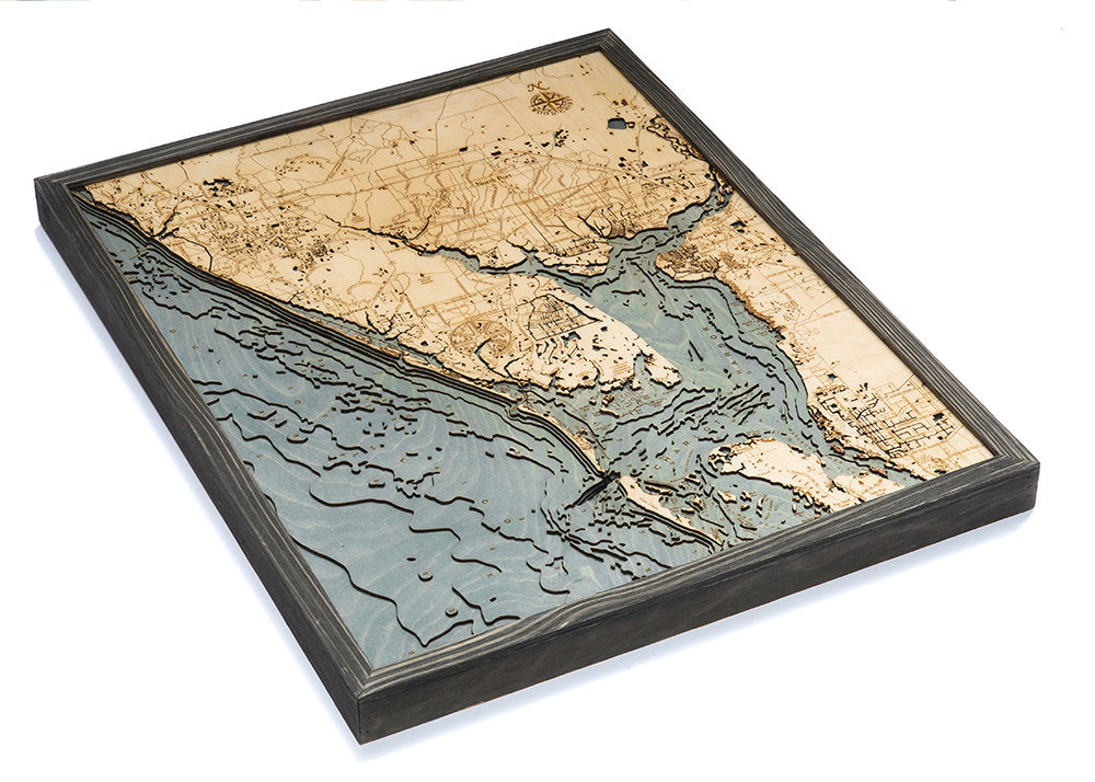 Charlotte Harbor, Florida 3D layered wood map in laser-cut Baltic birch, shown framed against a light wall