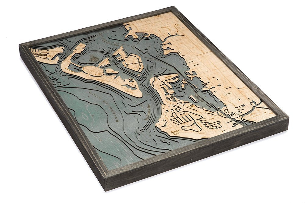 Siesta Key, Florida 3D layered wood map in laser-cut Baltic birch, shown framed against a light wall
