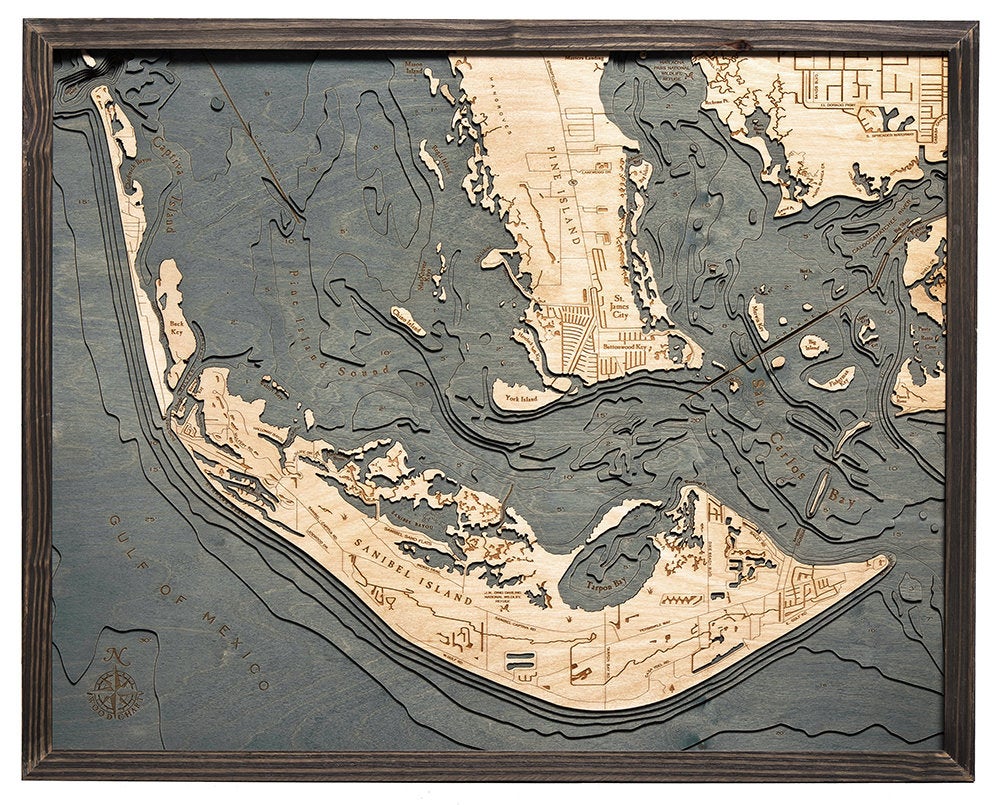 Sanibel Island, Florida 3D layered wood map in laser-cut Baltic birch, shown framed against a light wall