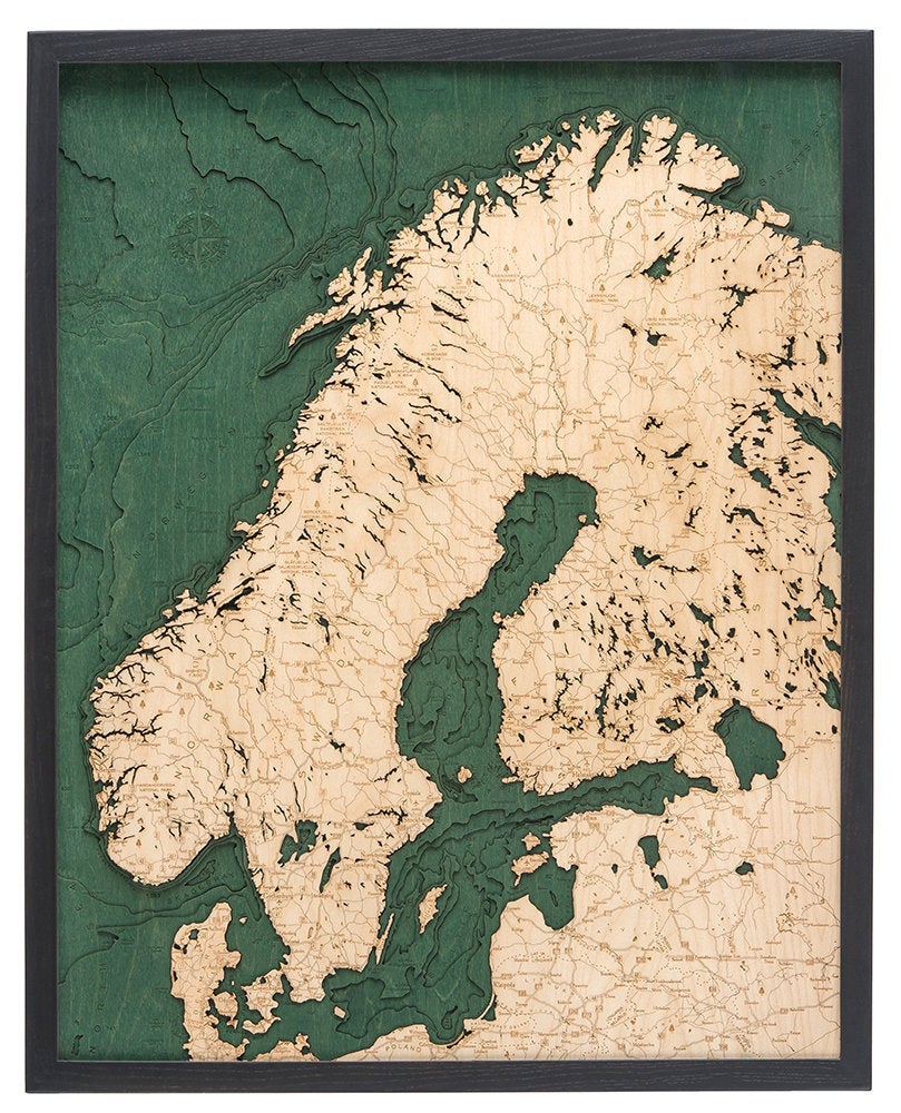 Scandinavia 3D layered wood map in laser-cut Baltic birch, shown framed against a light wall