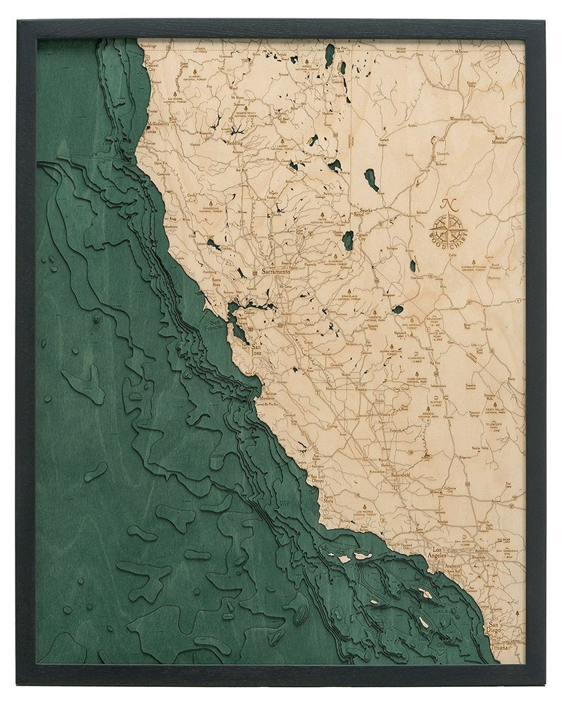 California Coast 3D layered wood map in laser-cut Baltic birch, shown framed against a light wall
