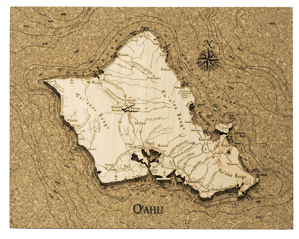 Oahu, Hawaii framed cork map in laser-cut Baltic birch, shown framed against a light wall