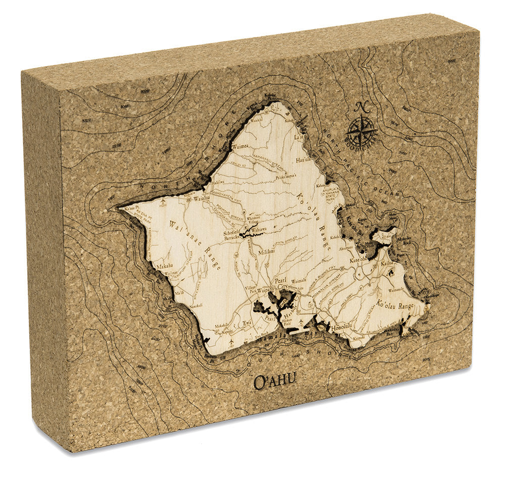 Oahu, Hawaii framed cork map in laser-cut Baltic birch, shown framed against a light wall