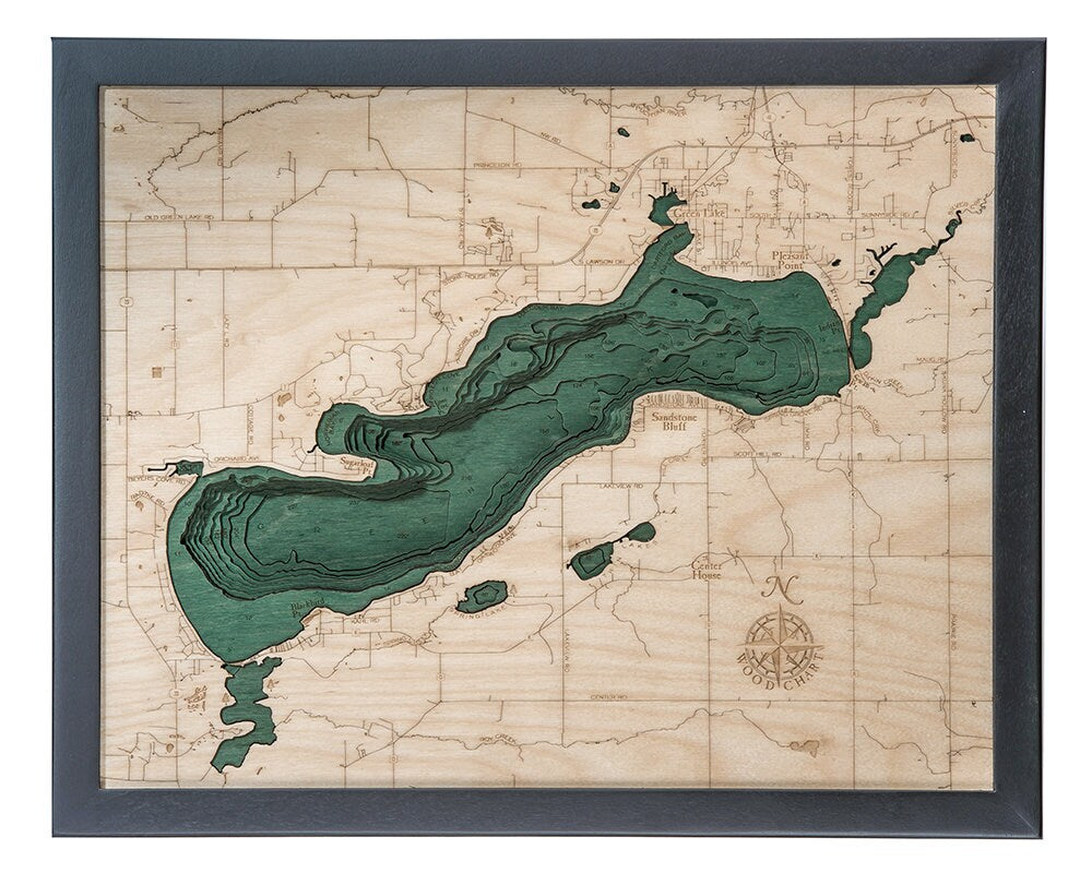 Green Lake, Wisconsin 3D layered wood map in laser-cut Baltic birch, shown framed against a light wall