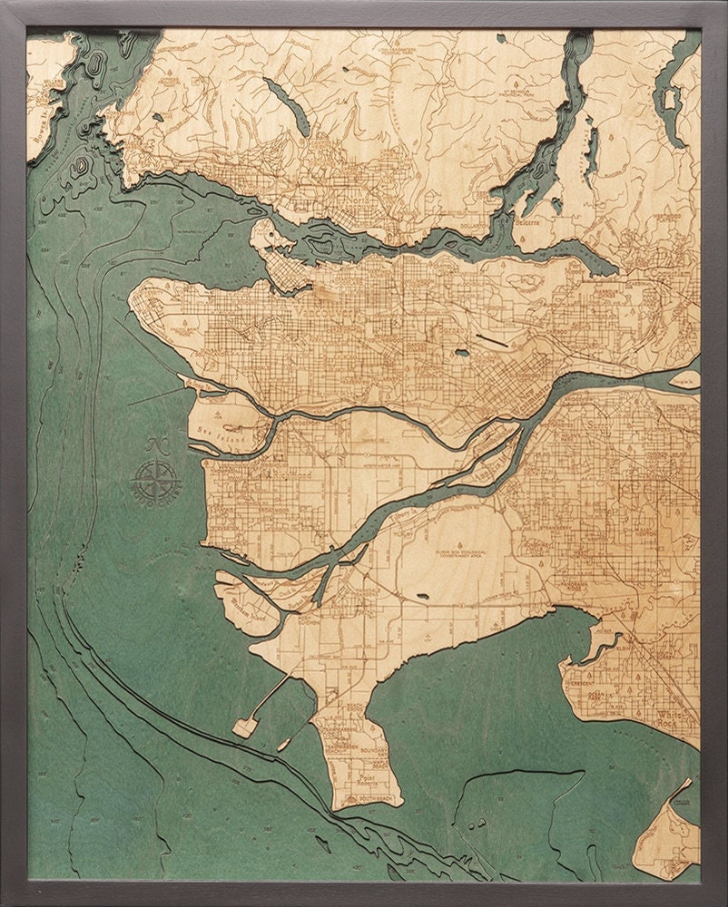 Vancouver, British Columbia 3D layered wood map in laser-cut Baltic birch, shown framed against a light wall