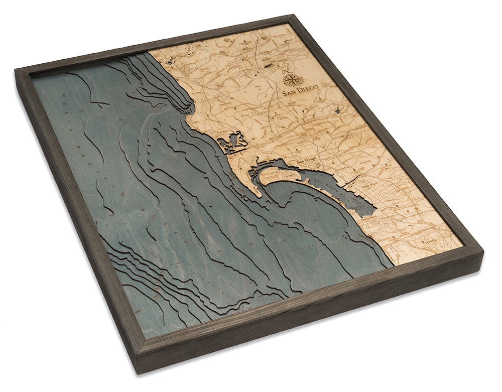 San Diego, California 3D layered wood map in laser-cut Baltic birch, shown framed against a light wall