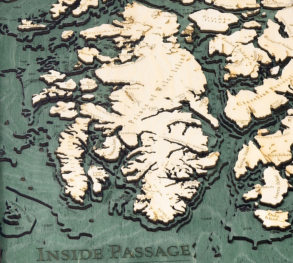 Inside Passage, Alaska 3D layered wood map in laser-cut Baltic birch, shown framed against a light wall