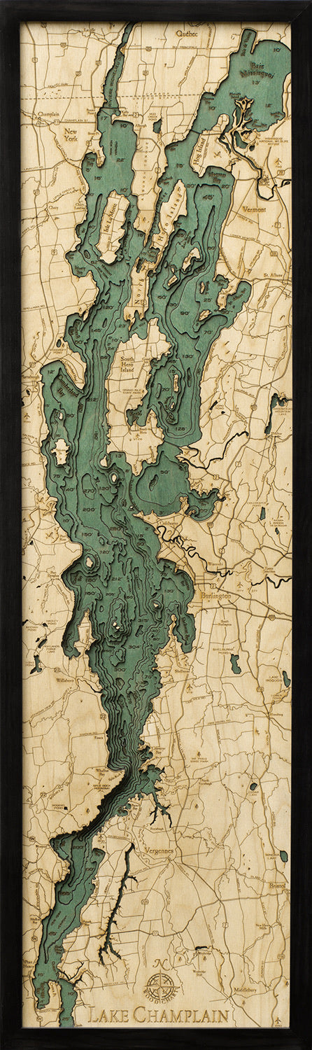 Lake Champlain 3D layered wood map in laser-cut Baltic birch, shown framed against a light wall