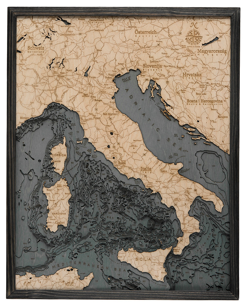 Italy 3D layered wood map in laser-cut Baltic birch, shown framed against a light wall
